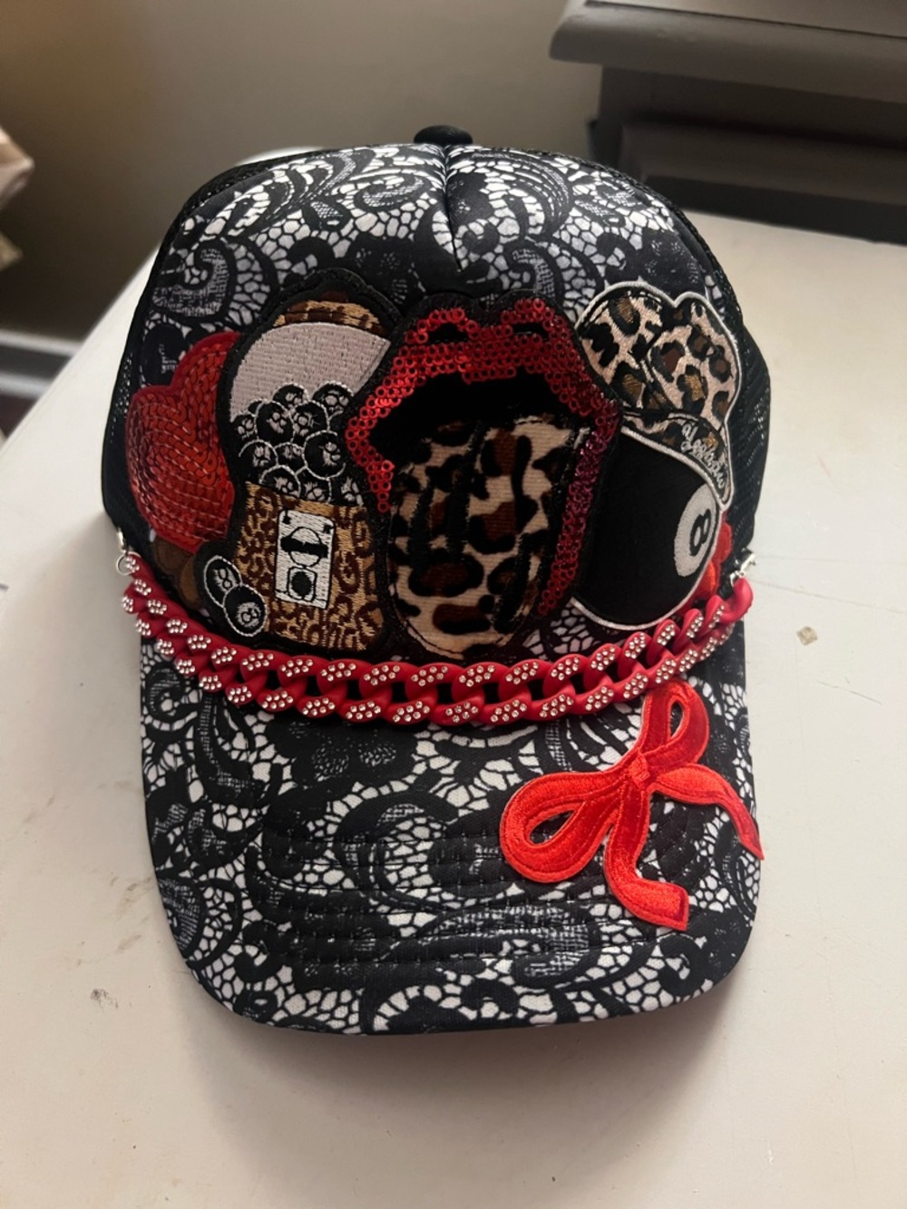 Black Lace Baseball Cap with Red Embellishments